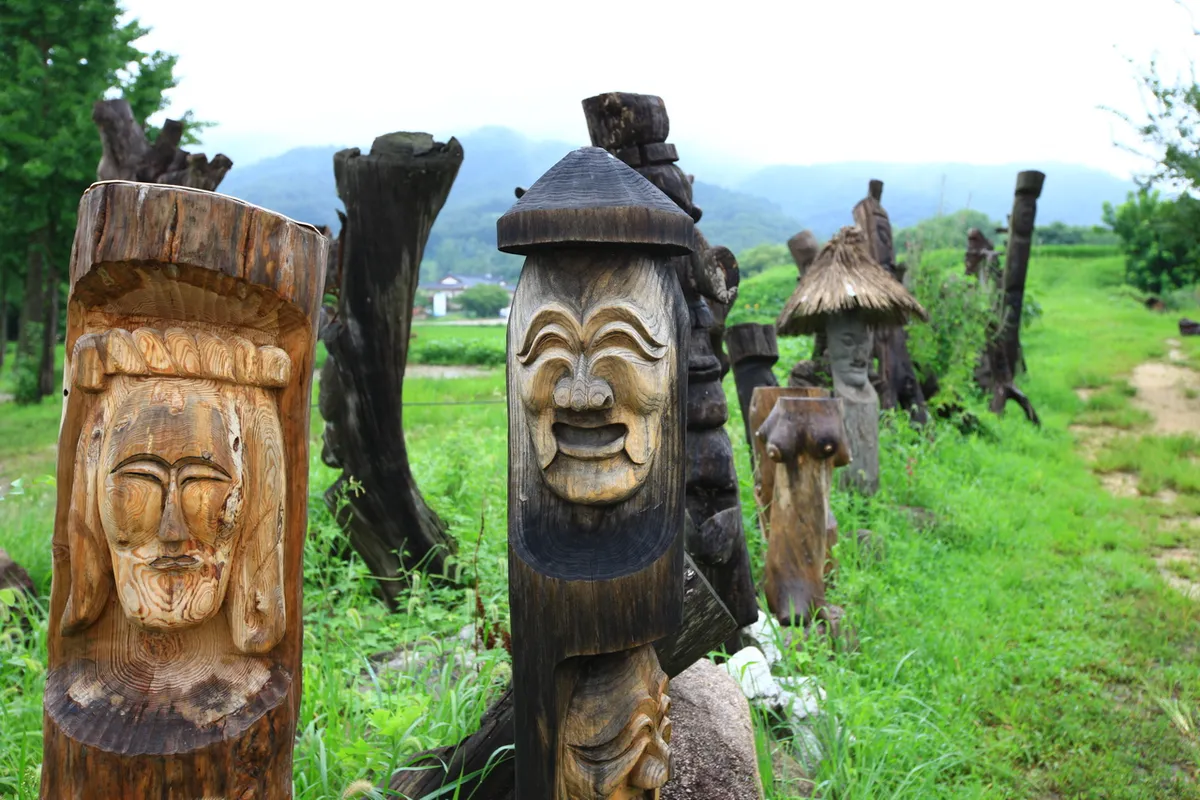 Wooden Hahoe mask figures displayed at Andong Hahoe Village