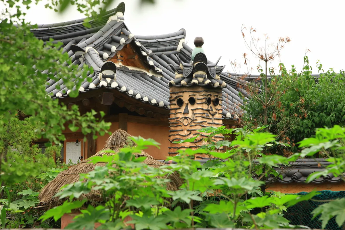 Stone wall and traditional house lane in Andong Hahoe Village guide