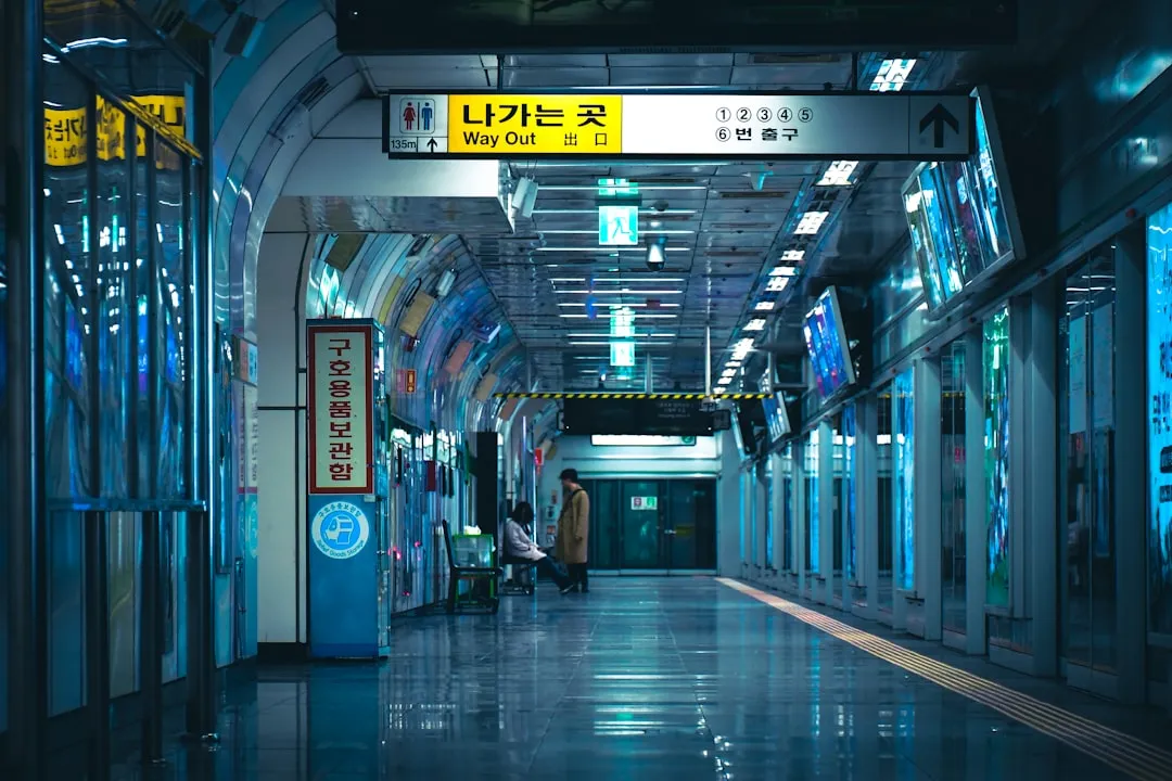 Passengers walking through airport rail corridor for AREX airport train travel