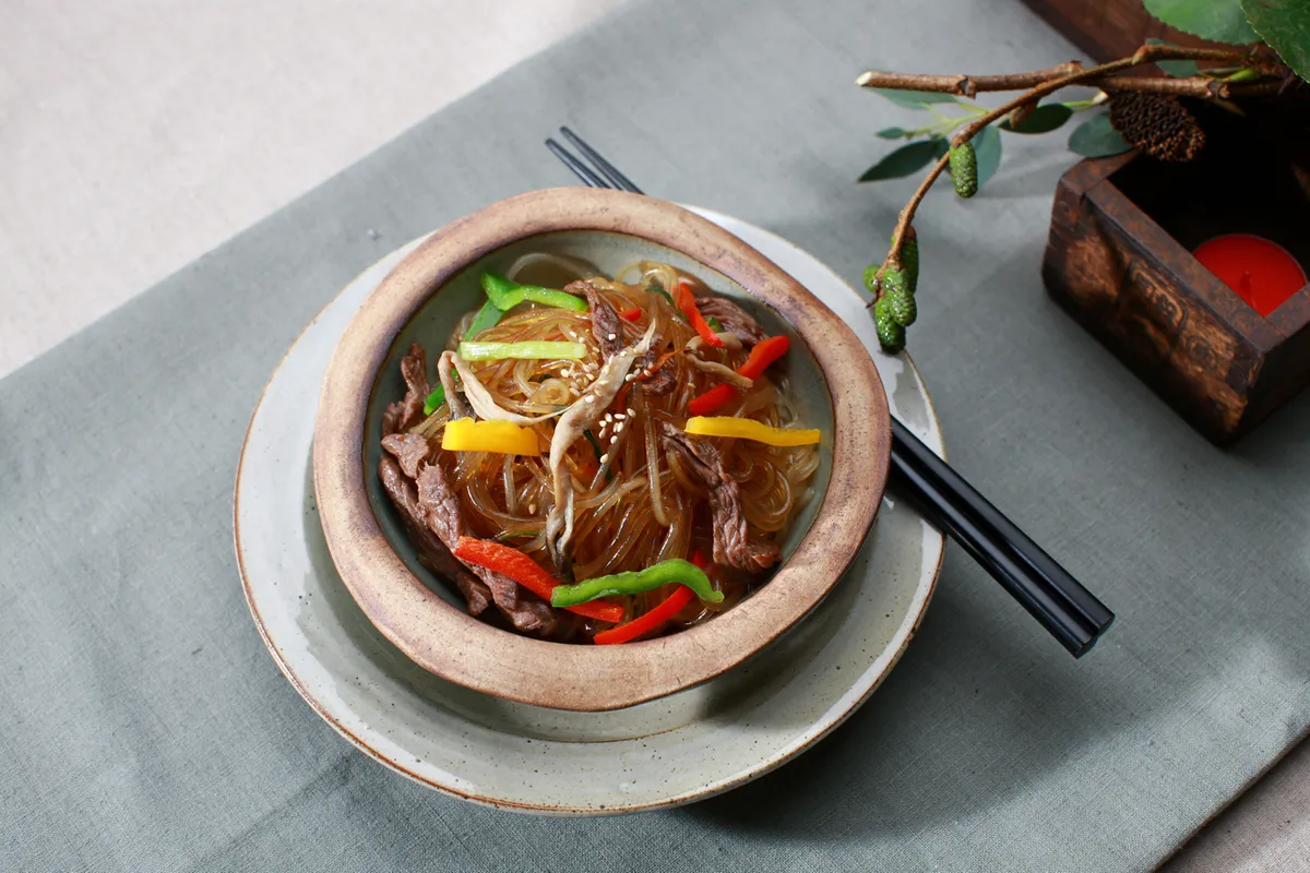 Japchae clear noodles with vegetables served as Korean side dish