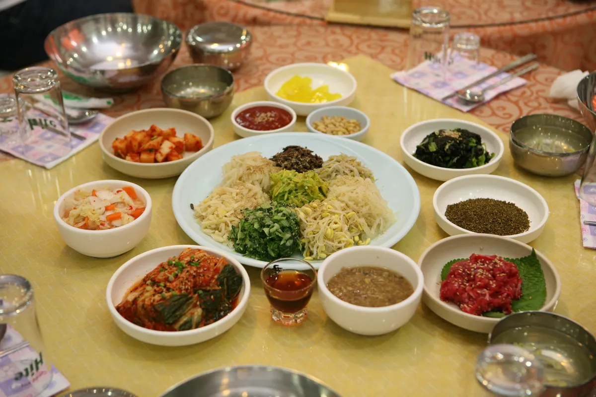Jinju traditional bibimbap with vegetables in a Korean rice bowl guide