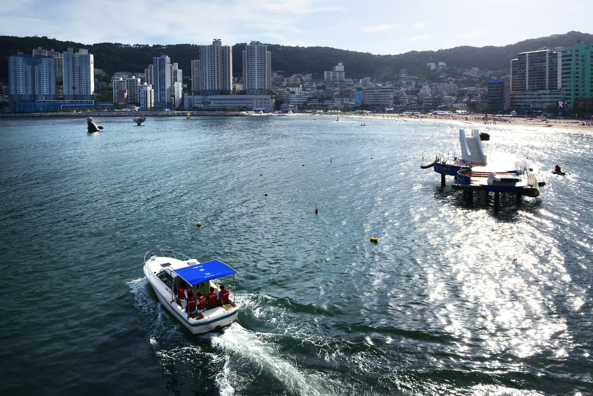 Busan Air Cruise cable cars above Songdo Beach coastline