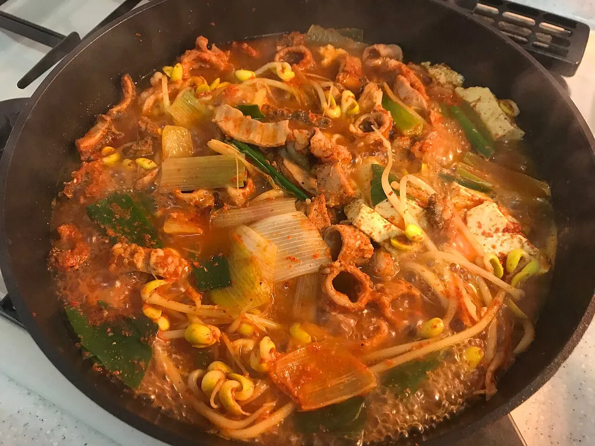 Gopchang-jeongol simmering with beef intestines, vegetables, and red broth