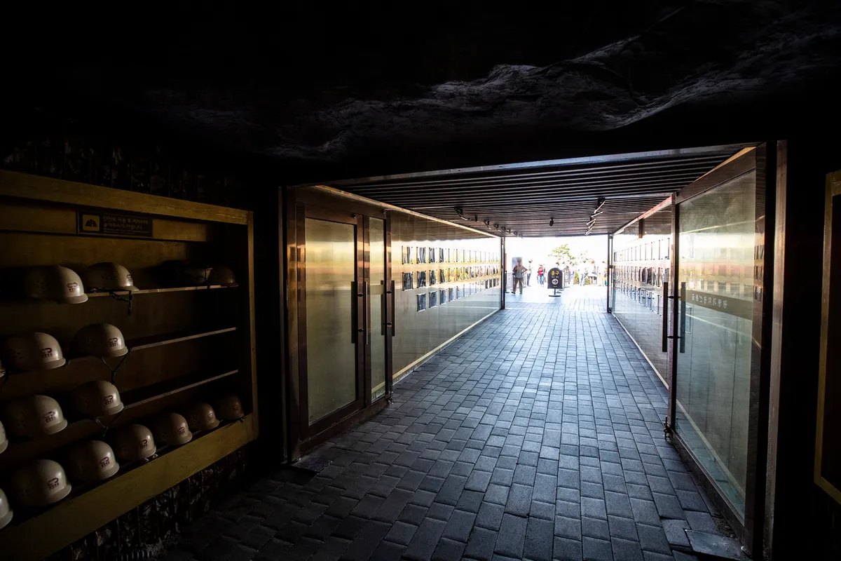 Straight underground passage with display walls inside Gwangmyeong Cave