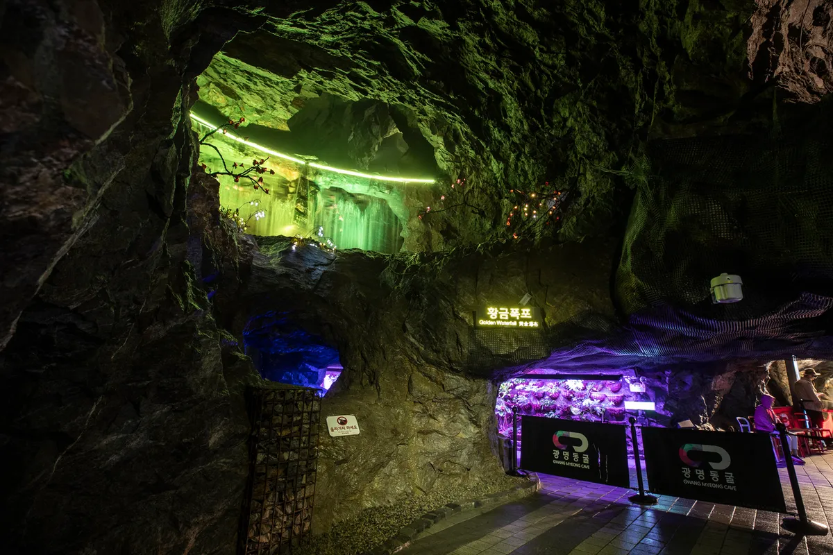 Golden Waterfall rock chamber and visitor path inside Gwangmyeong Cave