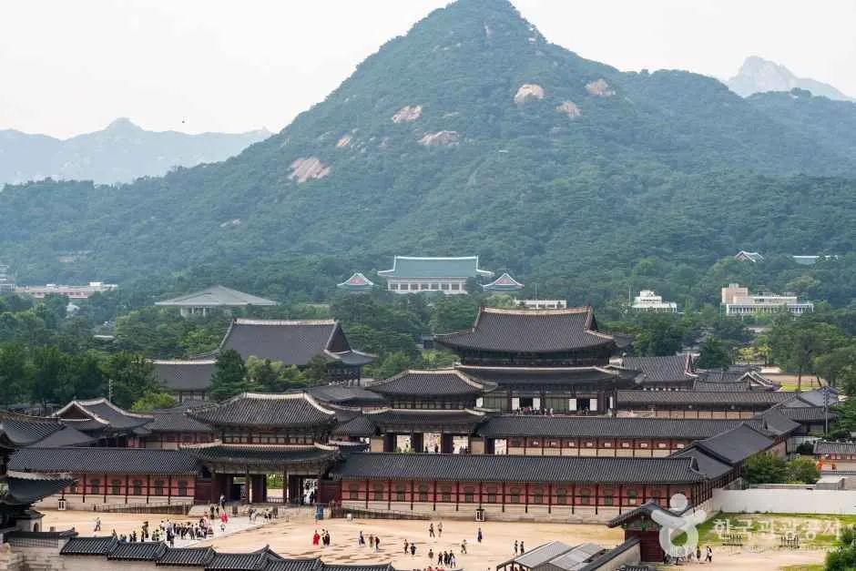 Gyeongbokgung Palace roofs and Bukhansan mountain behind the palace grounds