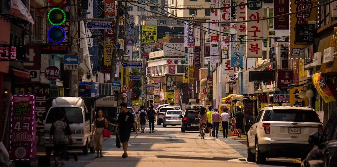 Pedestrians on a Seoul street using public transport routes