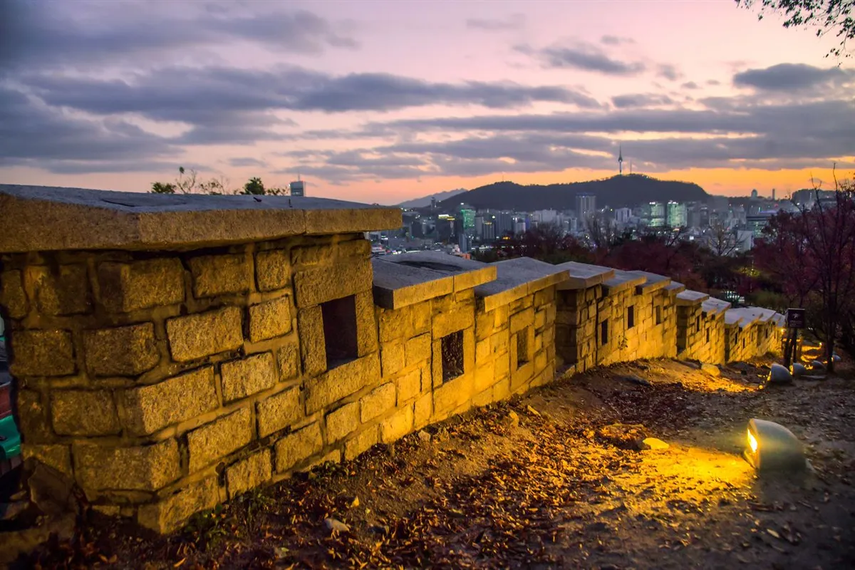 Stone wall and adjacent path at sunset on the Naksan section of Seoul City Wall