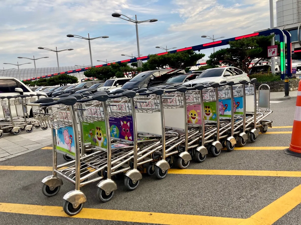 Rows of empty baggage trolleys at Incheon International Airport Terminal 1