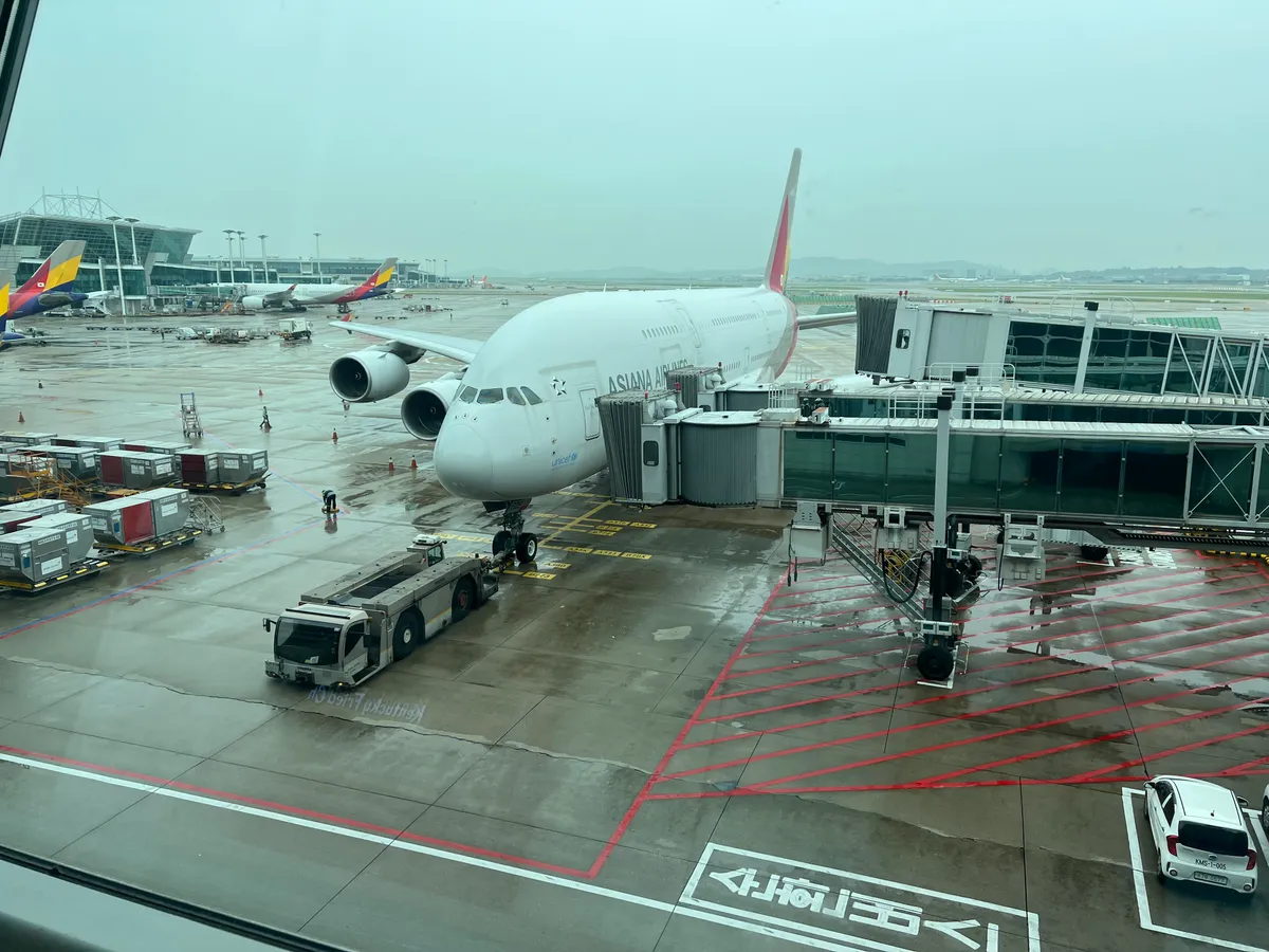 Asiana Airlines Airbus A380 parked beside passenger jetbridges at Incheon Airport