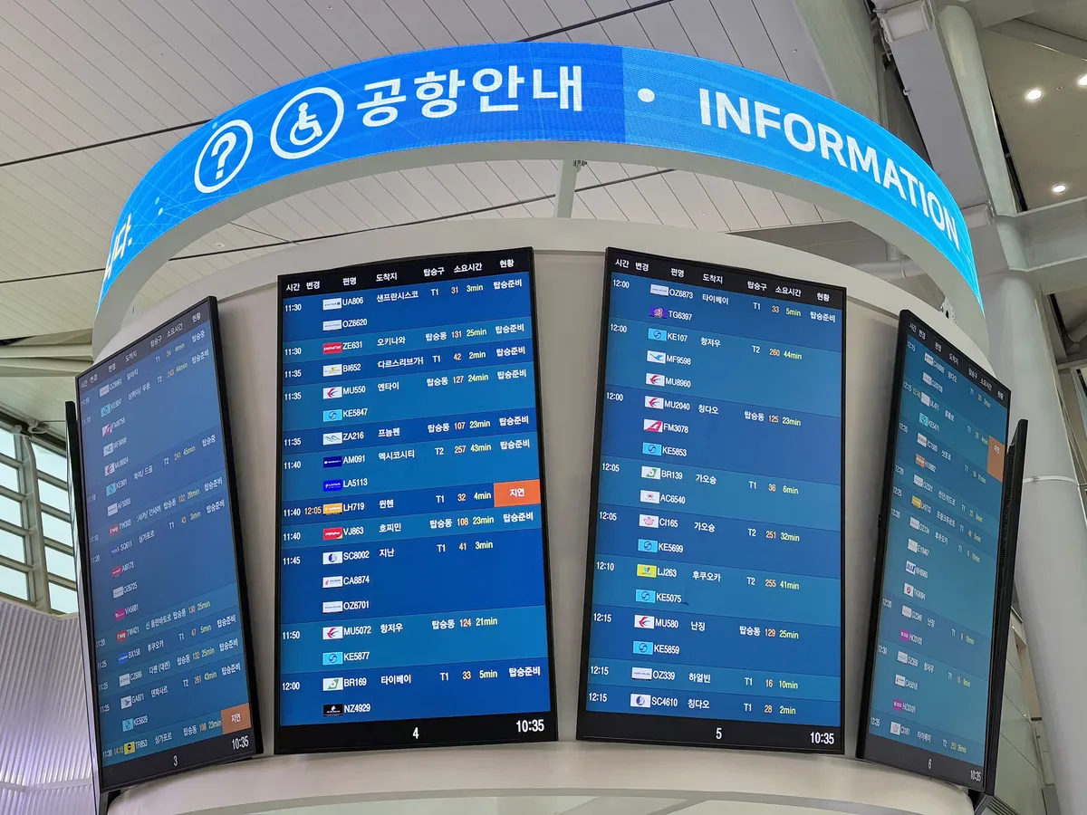 Airport information screens used to confirm departure details at Incheon Airport