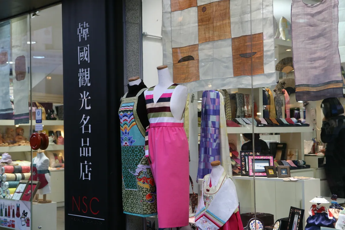 Traditional clothes and textile displays outside an Insadong shopfront