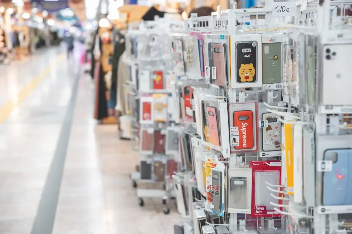 Phone cases and small accessories displayed along the Jungang underground mall corridor in Jeju City