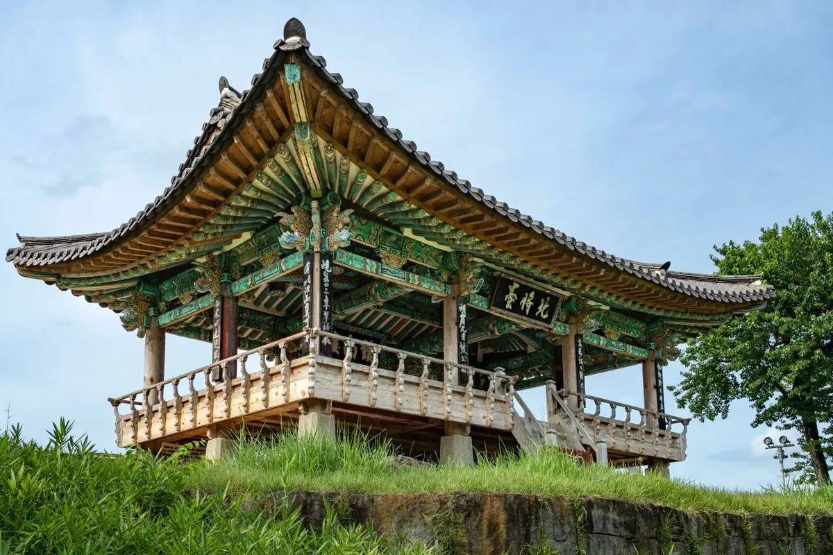 Upper wooden level and tiled roof of Chokseongnu Pavilion at Jinjuseong Fortress