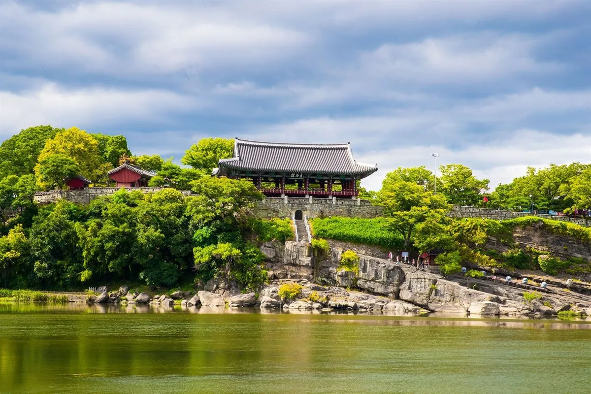 Chokseongnu Pavilion and its rocky cliff seen across the Namgang River in Jinju