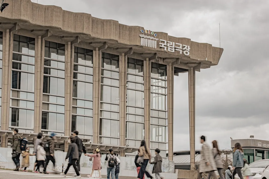 People walking outside a public building in Korea for K-ETA application guide