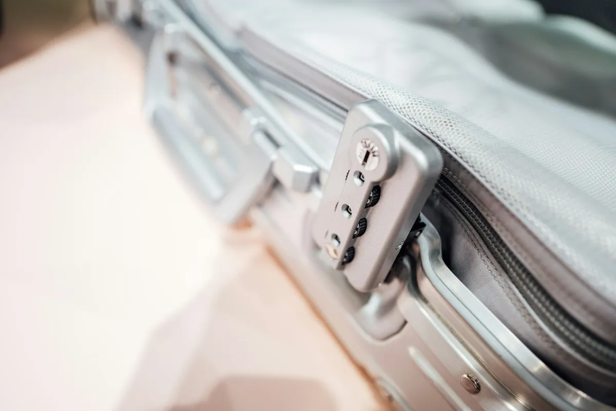 Combination lock on suitcase for carry-on and checked baggage sorting