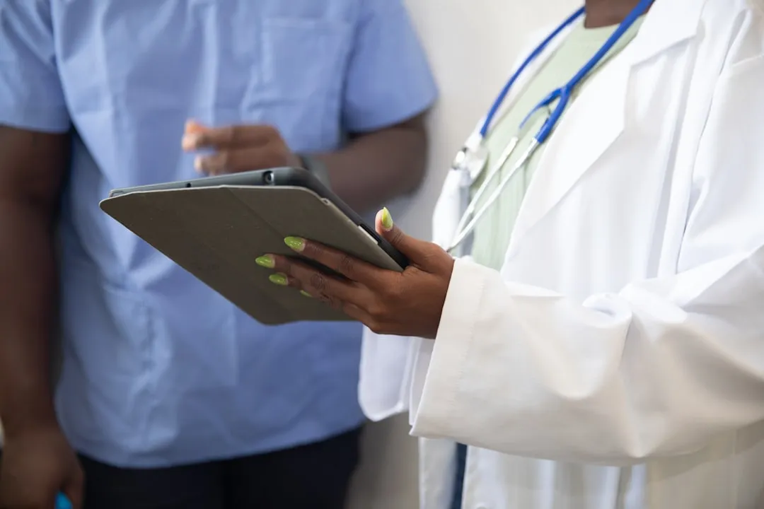 Doctor showing tablet to patient during hospital consultation in Korea