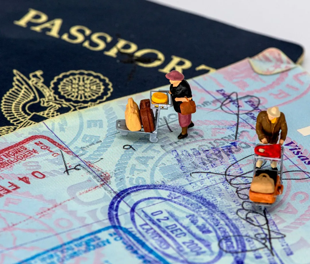 Miniature travelers standing on passport pages for a Korean visa application