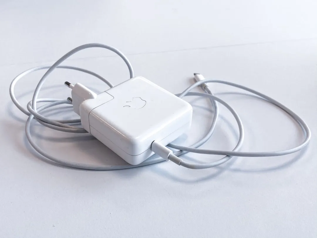White laptop charger for Korea travel adapter device input check
