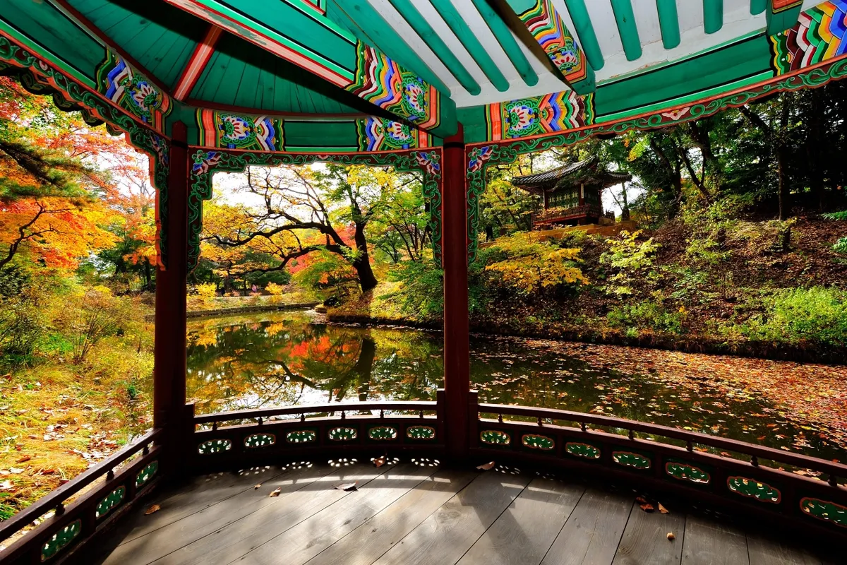 Autumn foliage viewed from a pavilion at Changdeokgung Palace for Korea weather planning