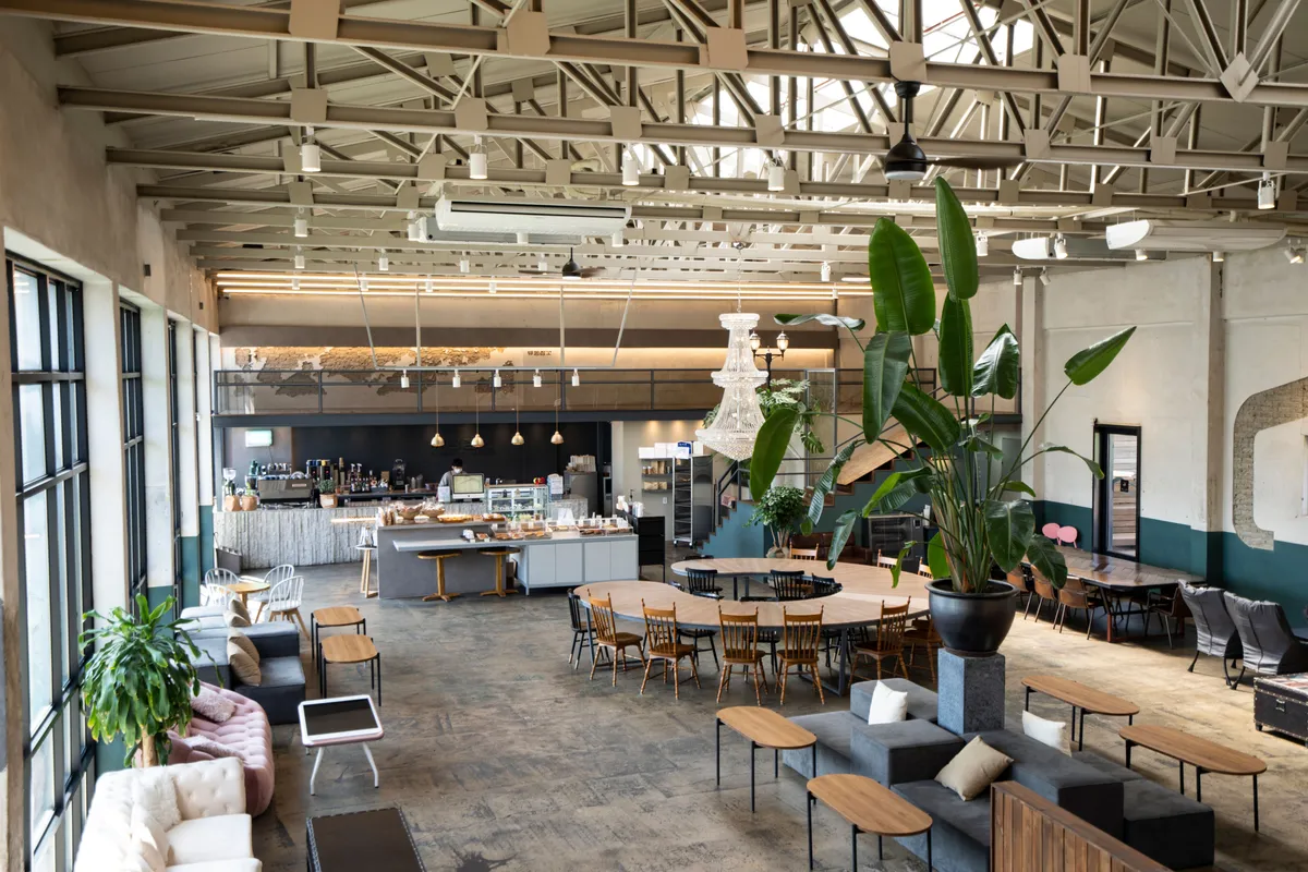 Large Korean cafe interior with a pastry display counter for a Korean cafe bakery guide