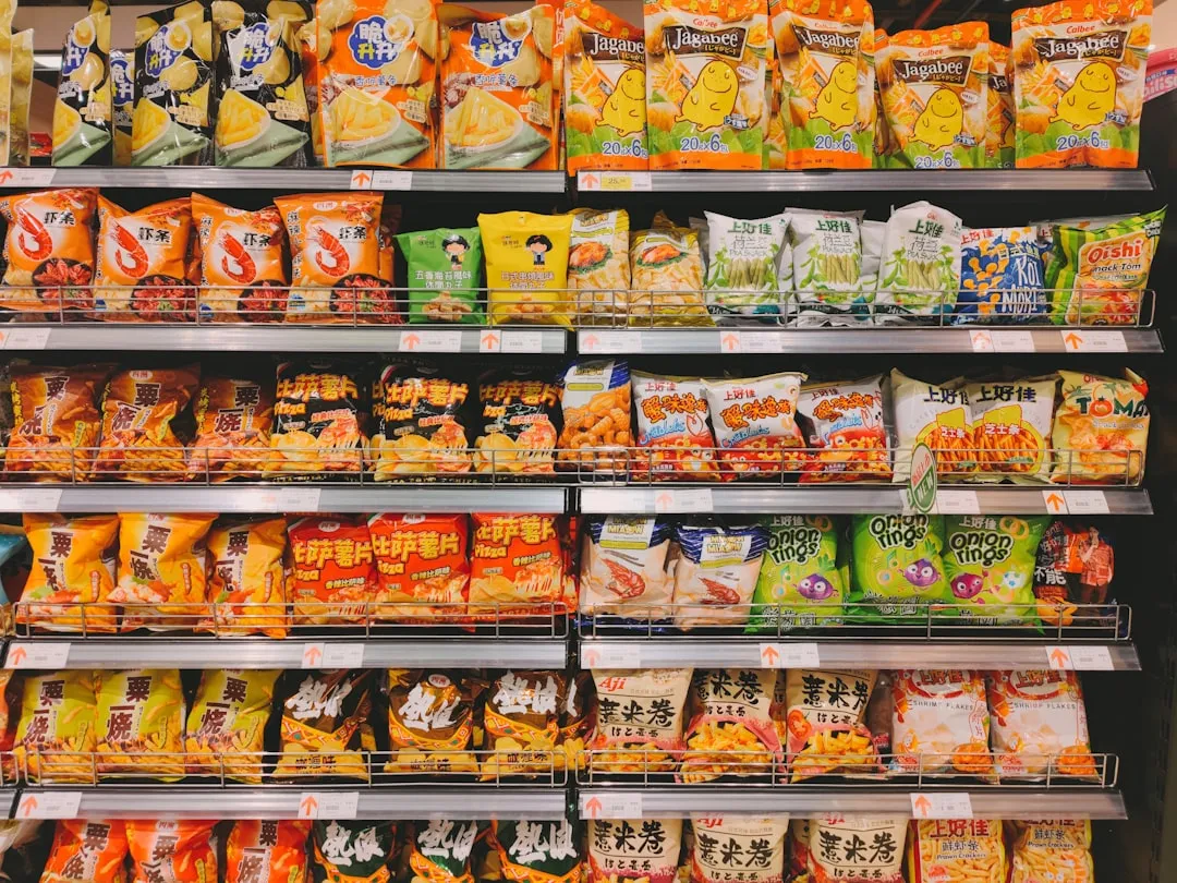 Convenience store shelves with packaged snacks for a Korean convenience store food guide