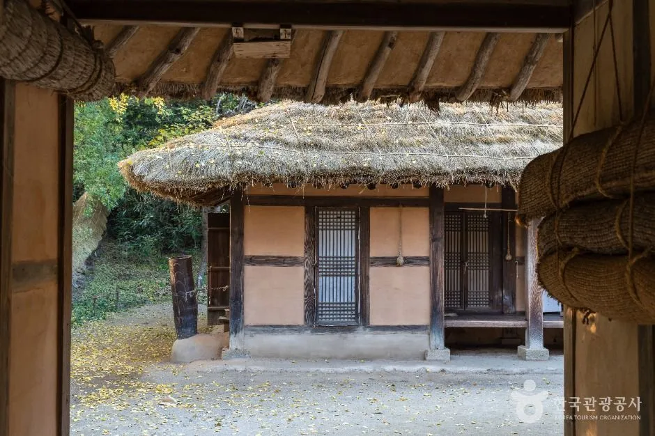 Thatched-roof house and dirt courtyard at Korean Folk Village