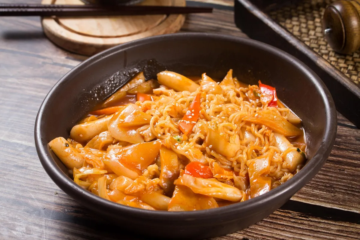 Tteokbokki spicy rice cakes in red sauce at a Korean street food shop