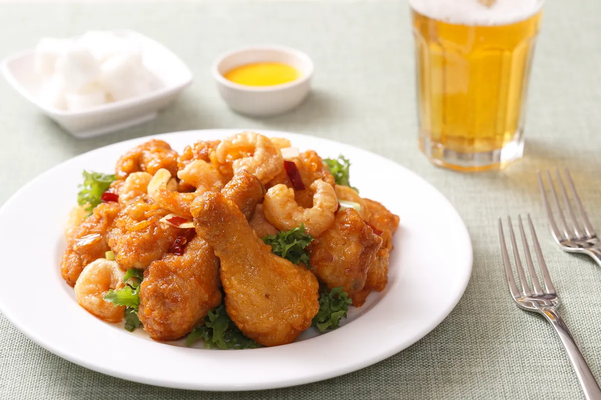 Korean fried chicken served with beer and pickled radish for a chimaek guide