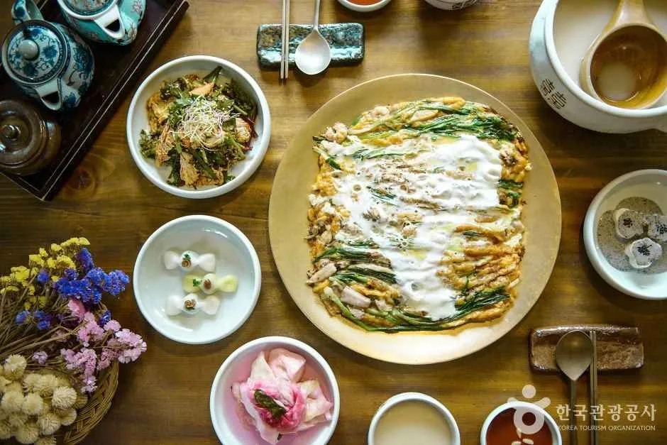 Dongnae pajeon green onion pancake on a table for Korean Jeon Guide
