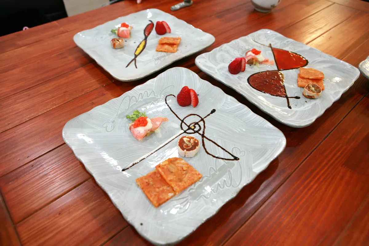 Kimchi-jeon pieces served on white plates for Korean Jeon Guide