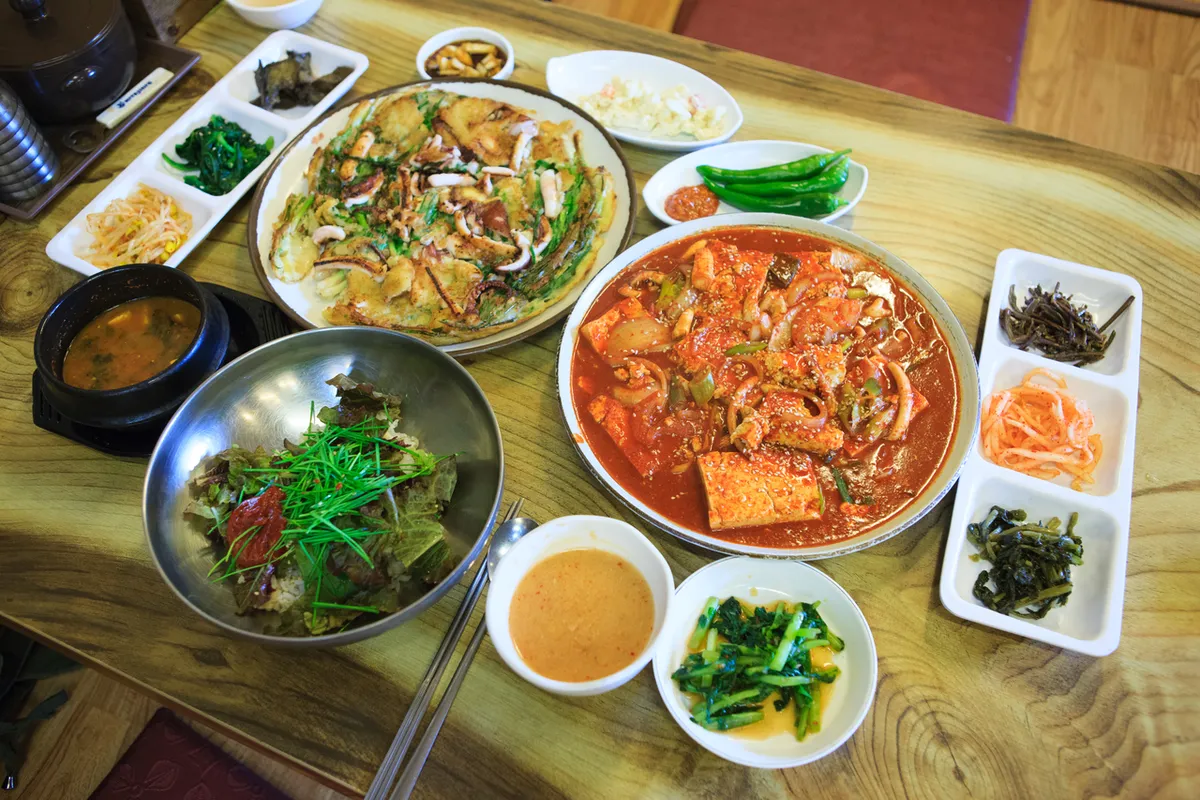 Haemul pajeon served with Korean side dishes for Korean Jeon Guide