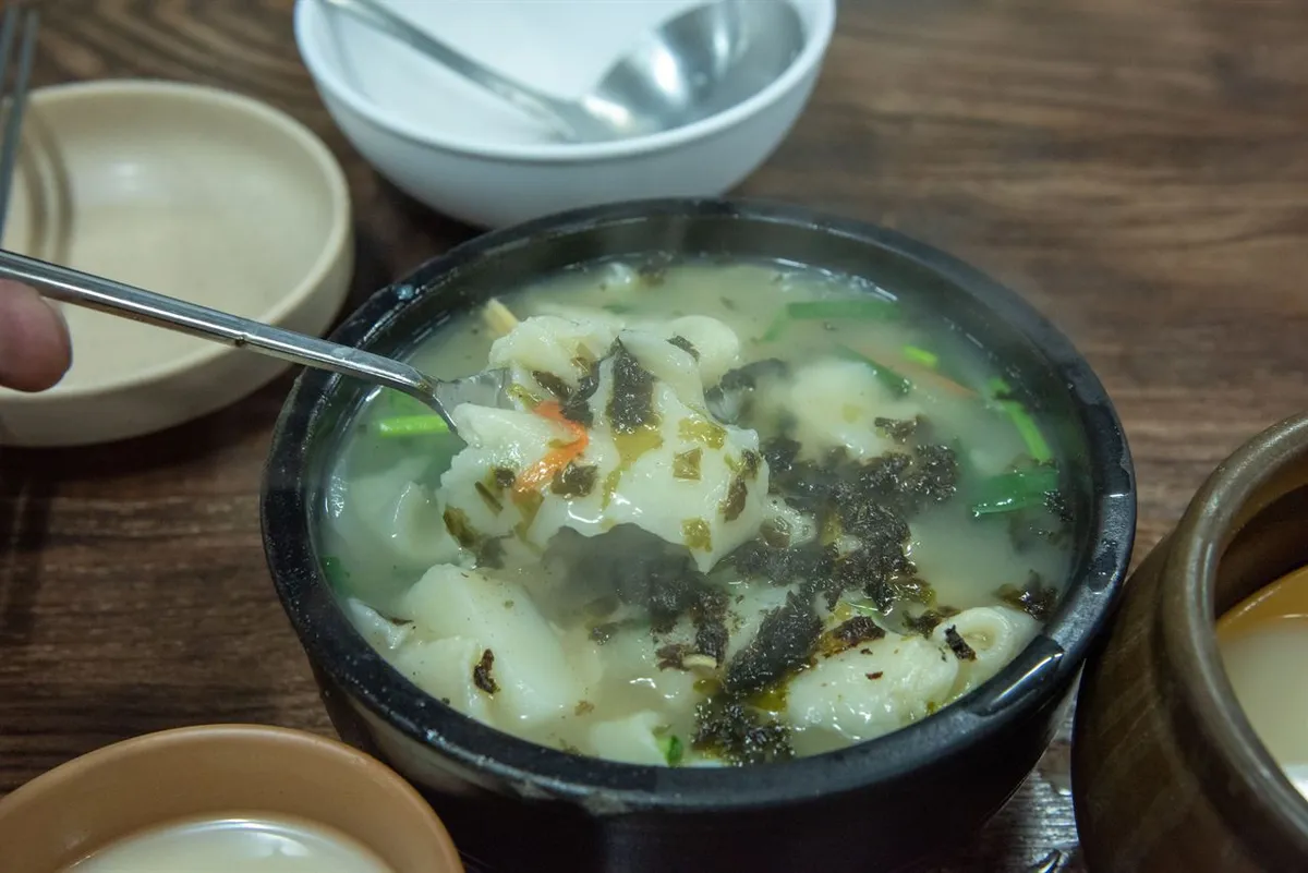 Sujebi soup with hand-torn dough pieces for a Korean noodles guide