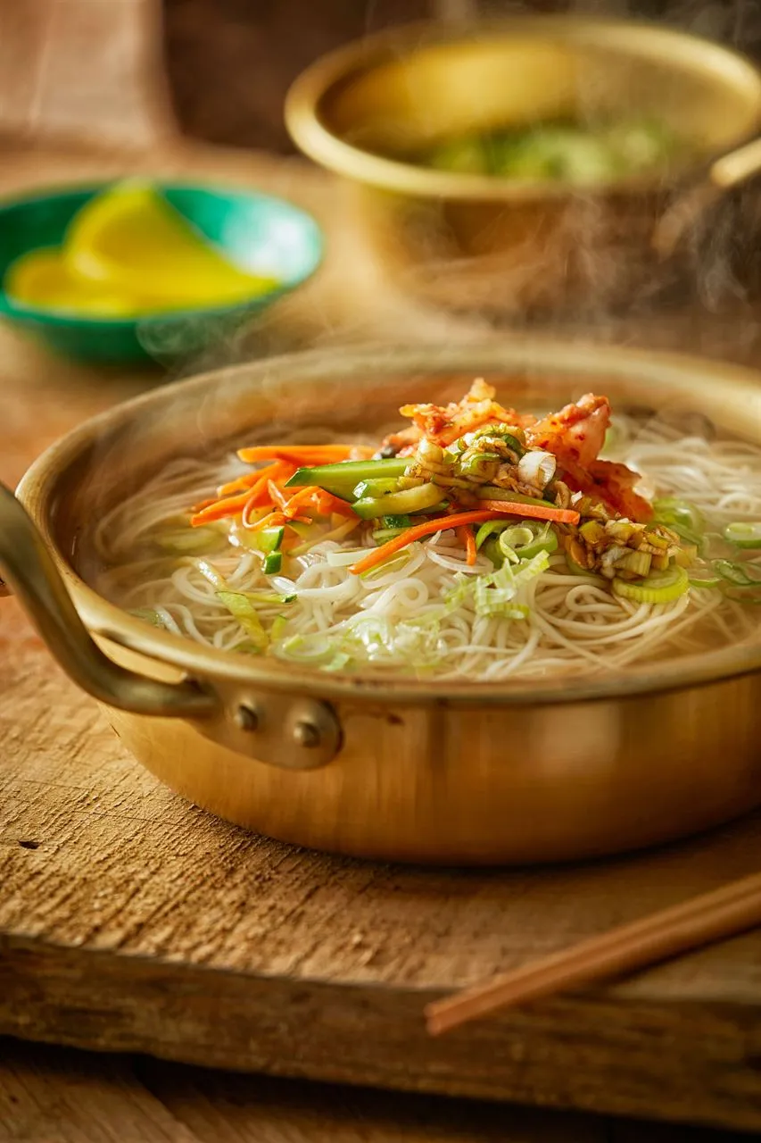Warm Korean guksu noodles served in a metal pot for a Korean noodles guide