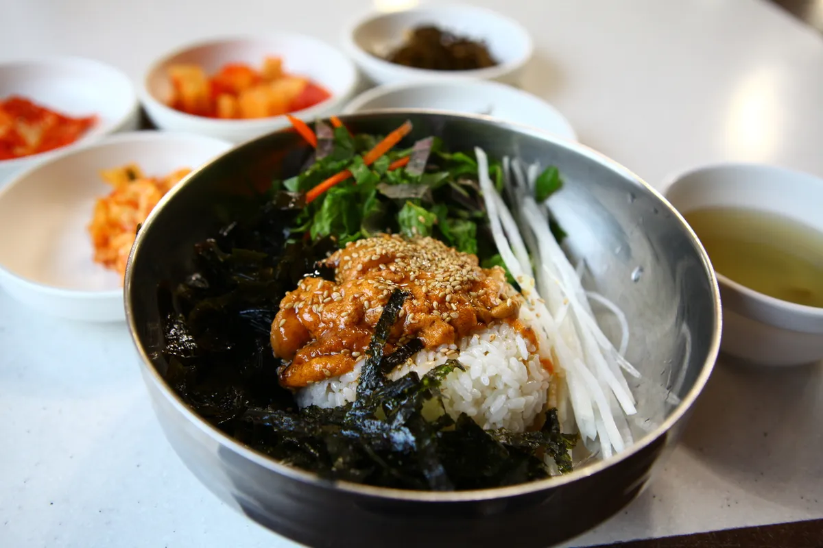 Sea urchin deopbap served over rice as a Korean rice dish