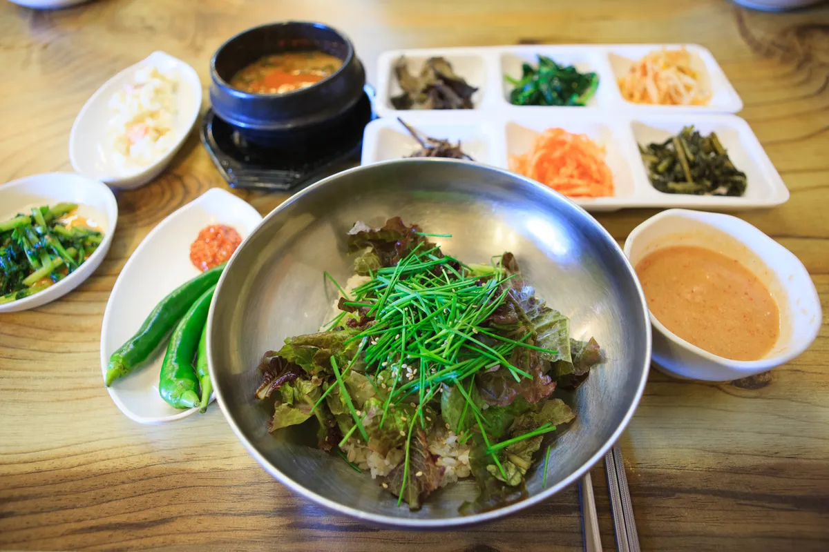 Barley rice meal with Korean side dishes for a Korean rice dishes guide