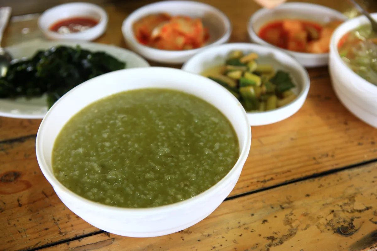 Jeonbokjuk abalone rice porridge served in a bowl for Korean seafood guide