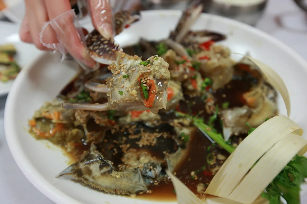 Ganjang gejang soy marinated crab served as Korean seafood dish