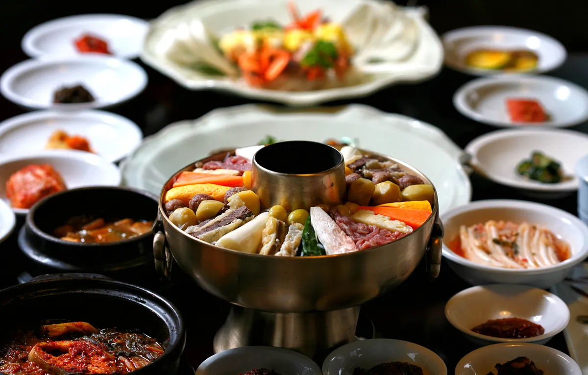 Hanjeongsik meal with sinseollo hot pot rice kimchi and side dishes