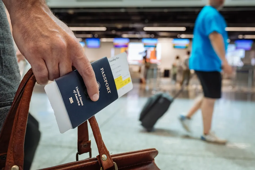 Hand holding a passport booklet for missing passport guide in Korea