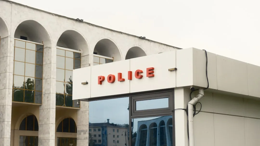 Police sign on a building for passport loss reporting guidance in Korea