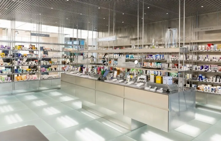 Cosmetics shelves and a metal display counter on the Olive Young N Seongsu shopping floor