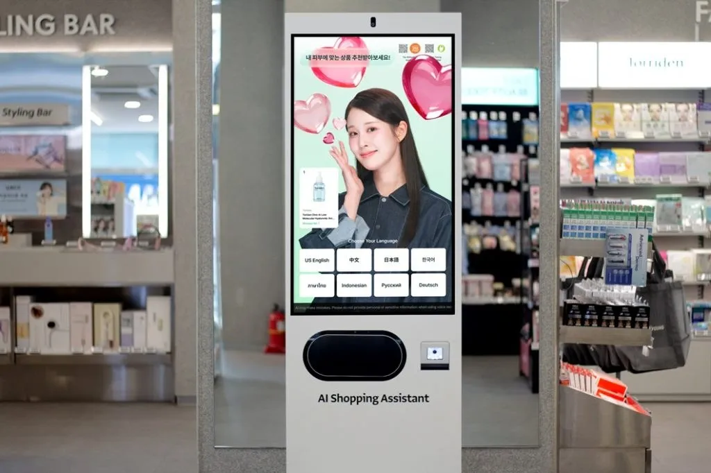 Olive Young AI Shopping Assistant kiosk standing beside cosmetics shelves