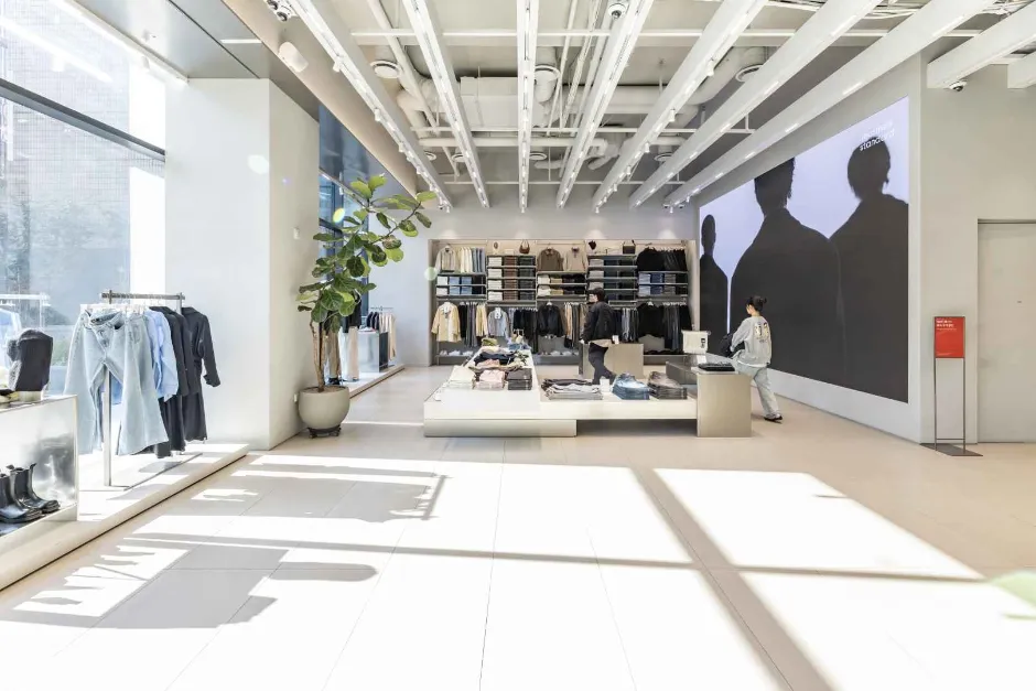 Bright retail floor with clothing displays at Musinsa Standard Seongsu shopping route