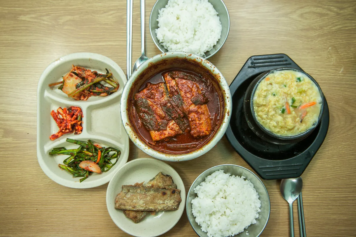 Braised hairtail in red sauce served with rice and side dishes at Namdaemun Market in Seoul