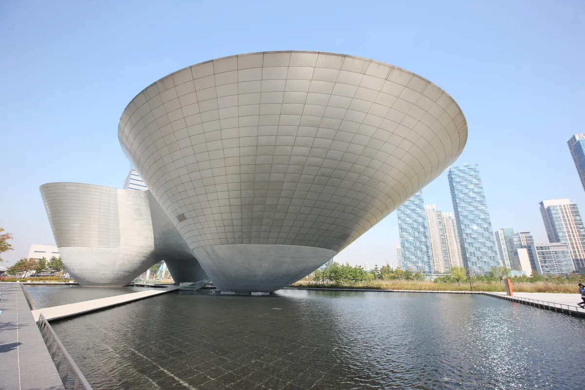Tri-Bowl architecture beside water in Songdo International City