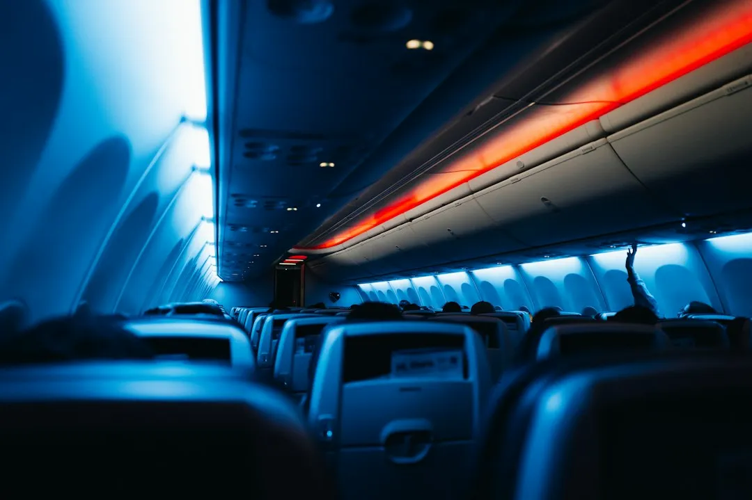 Rows of airplane cabin seats illustrating the airfare category in a Korea travel budget