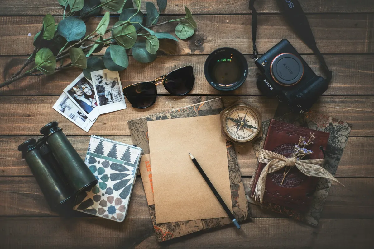 Notebook and travel equipment arranged for South Korea travel planning