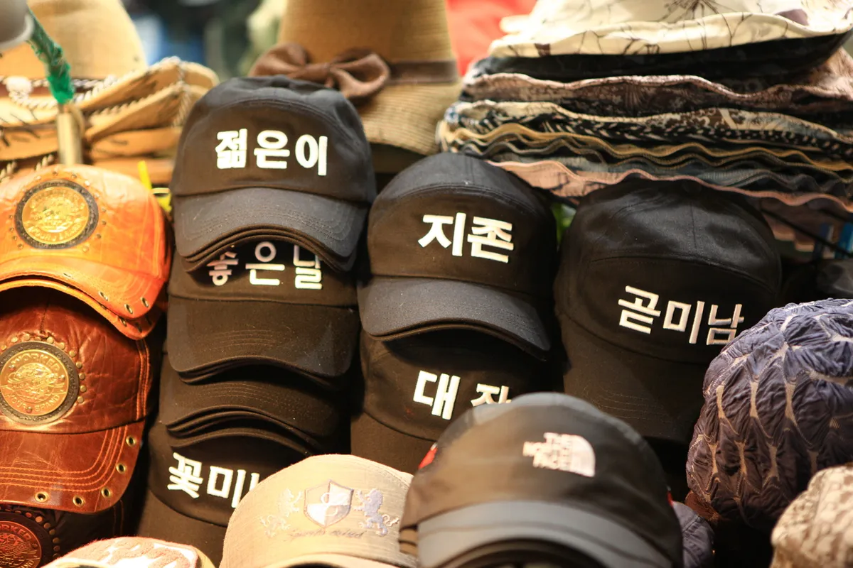 Caps and winter accessories displayed at Gukje Market in Busan